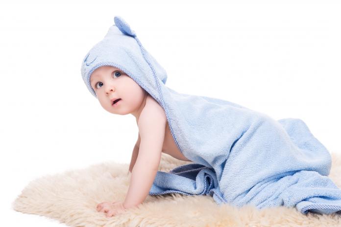 cute baby in blue bathrobe isolated on white badcape kind