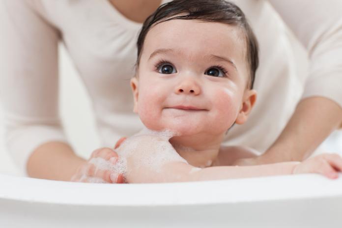 Baby boy having a bath baby bad