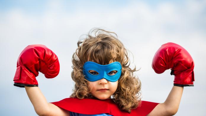 Superhero kid. Girl power concept