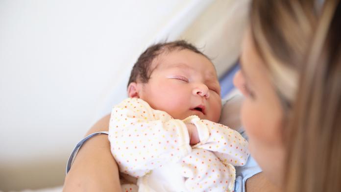 New born baby with his mother