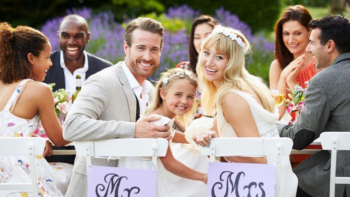 Bride And Groom With Bridesmaid At Wedding Reception