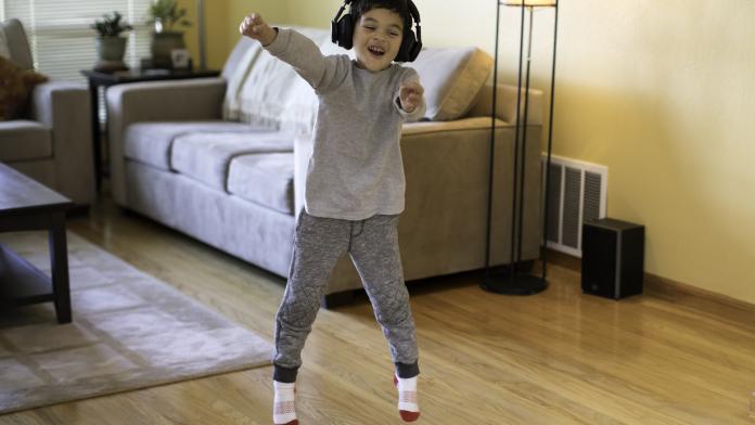 Young Boy Listening to Music and Rocking Out
