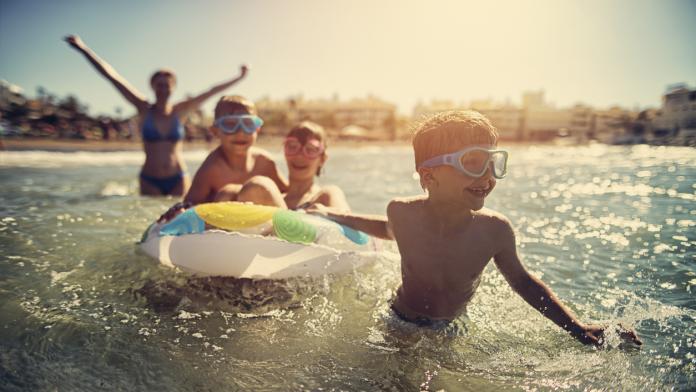 Family having fun in summer sea