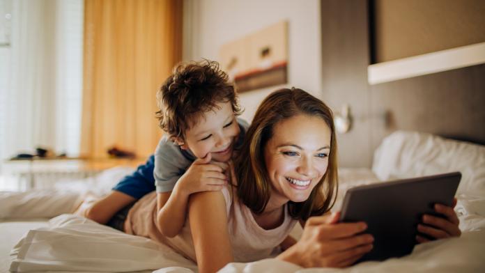Mother and son using a digital tablet