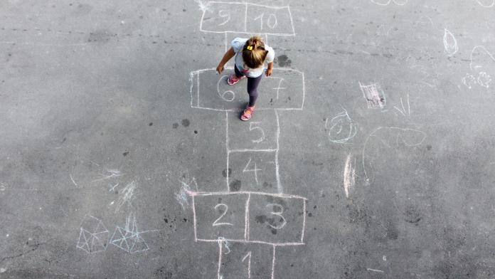 Girl on the hopscotch
