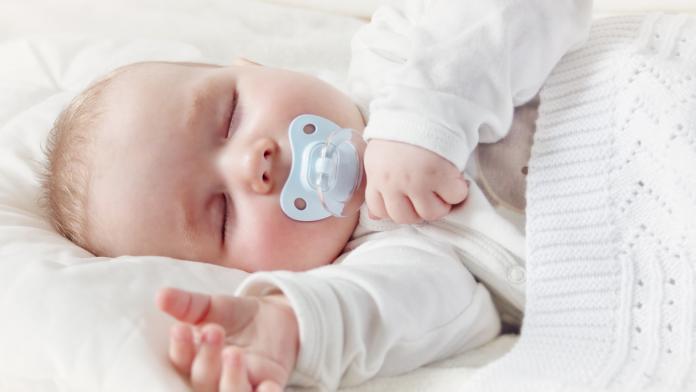 Baby sleeping covered with soft blanket