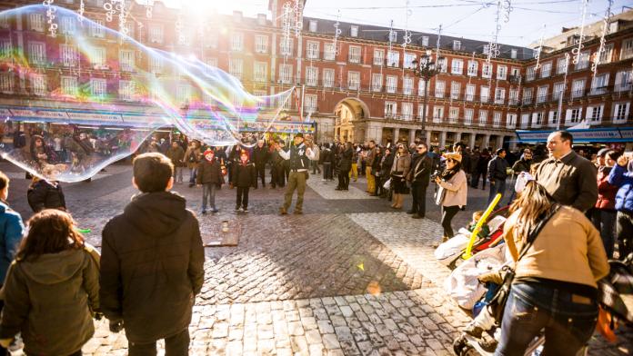 Crowds visiting Christmas Market on Plaza Mayor, Madrid