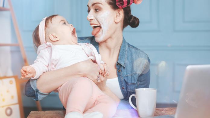 Happy delighted woman having fun with her daughter