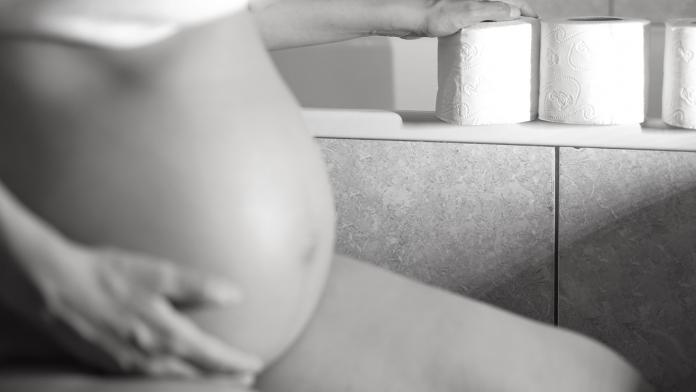 Woman in a toilet room