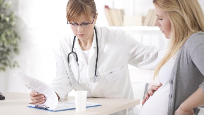 Pregnant woman at doctor's office.