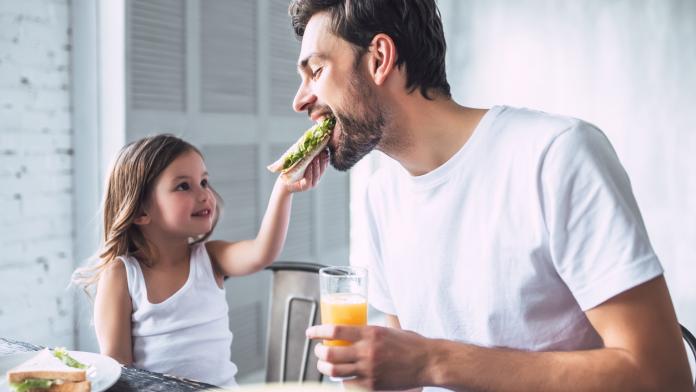 Dad with daughter at home