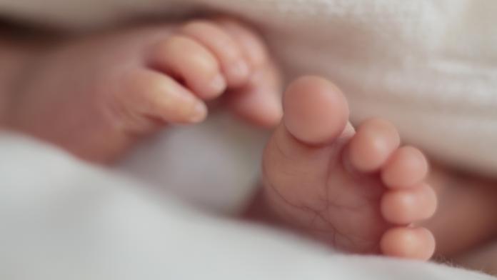 Both of feet of sleeping baby