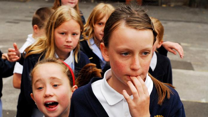 United Kingdom, England, London, Eltam, schoolgirls looking with different expressions