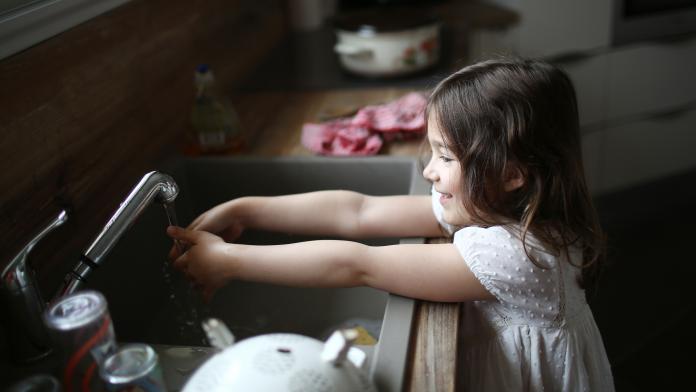 A girl washing her hands