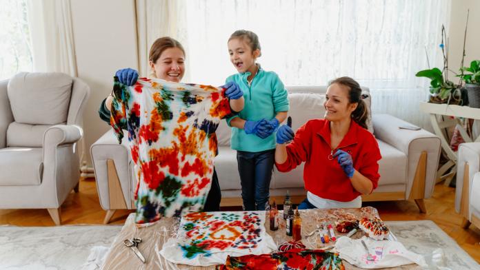 Family making tie dye together