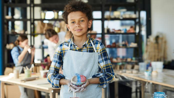 Boy with clay cup workshops