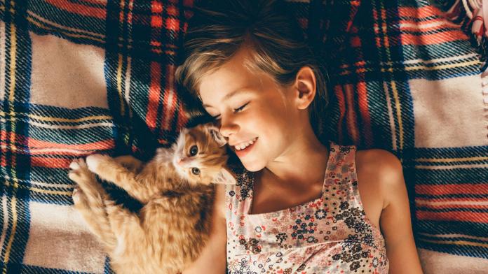 Little girl with kittens