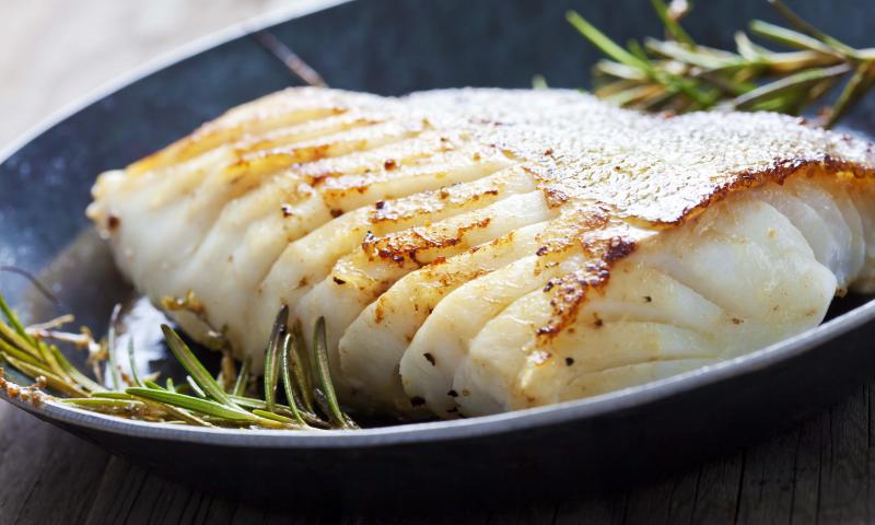 Fried fish fillet, Atlantic cod with rosemary in pan; Shutterstock ID 266014253