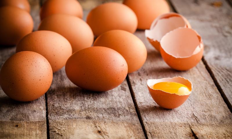 Fresh farm eggs on a wooden rustic background; Shutterstock ID 236452465